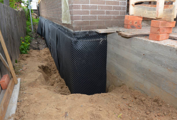 Happy homeowners after waterproofing job in Deer Park